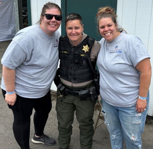 Nicholas and his mom with the Sheriff and Police at a table