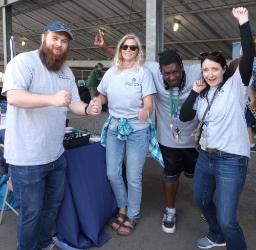 Nicholas and his mom with the Sheriff and police at a table
