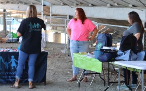 Greeting visitors at the Pave table
